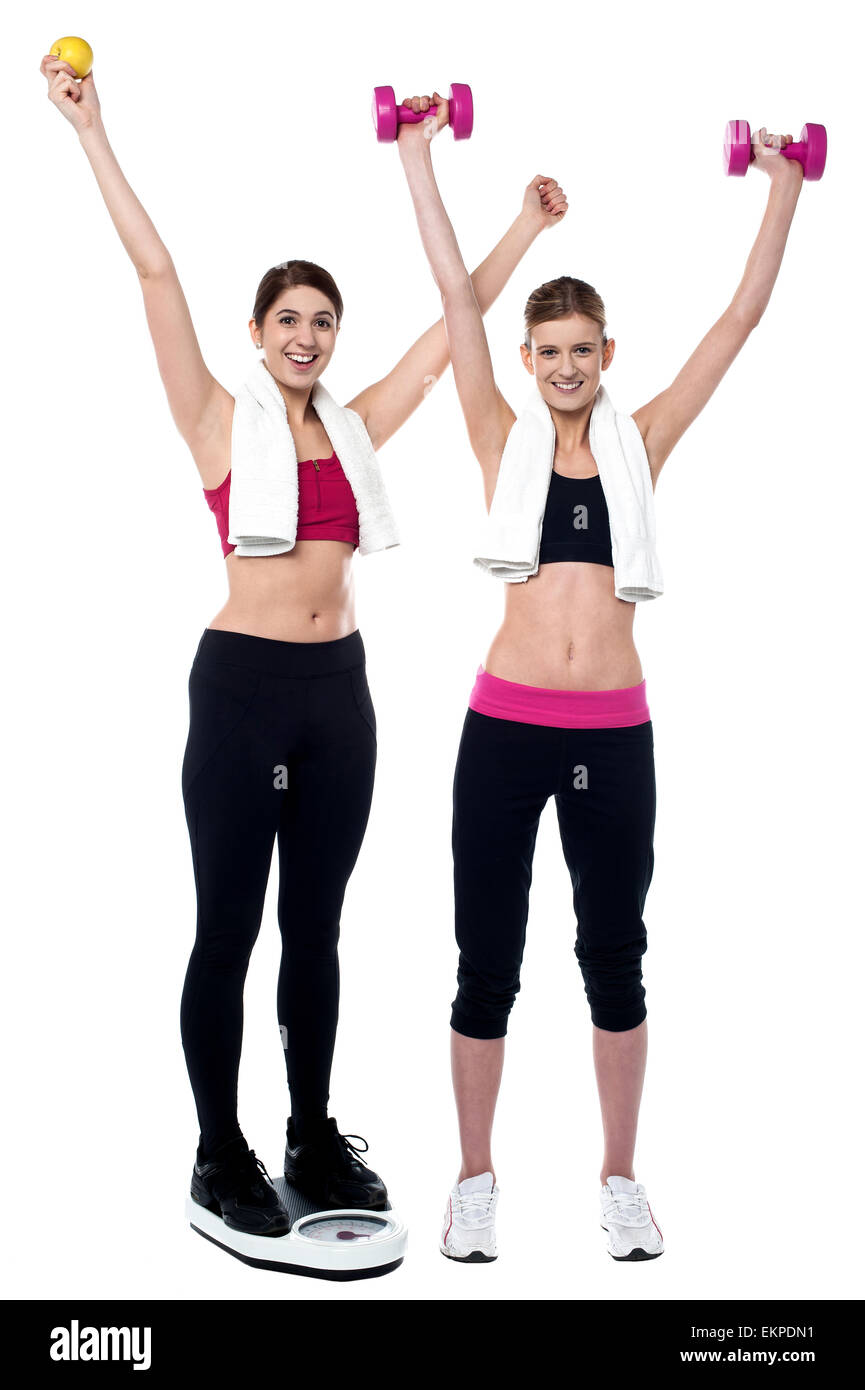 Two smiling girls working out together Stock Photo