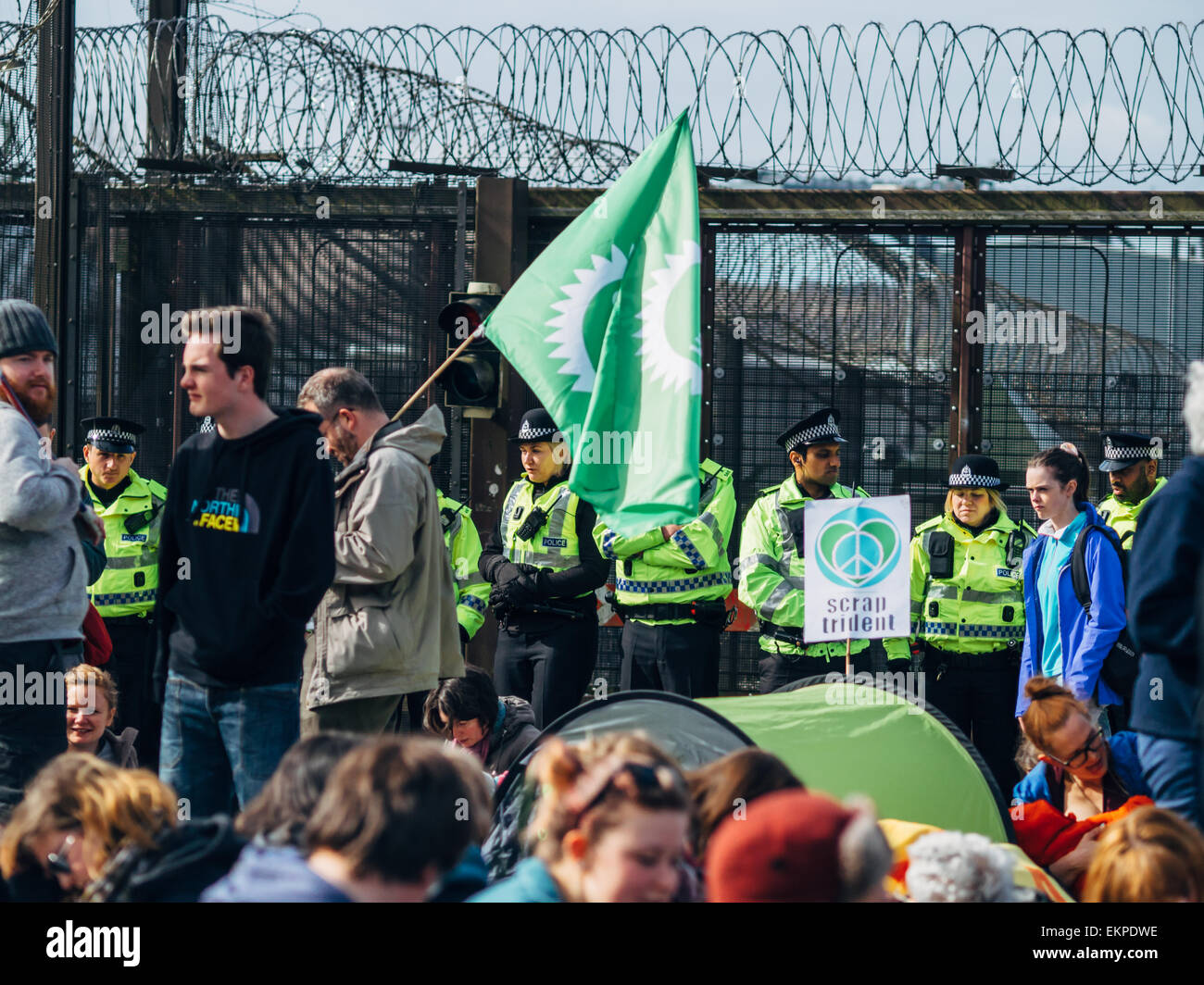 Glasgow, UK. 13th April, 2015. Protestors of all ages gather at Faslane Naval base in Glasgow to capmpaign against the Trident nuclear submarines based there, with the slogans 'Scrap Trident' & #BairnsNotBombs. Credit:  Alan Robertson/Alamy Live News Stock Photo