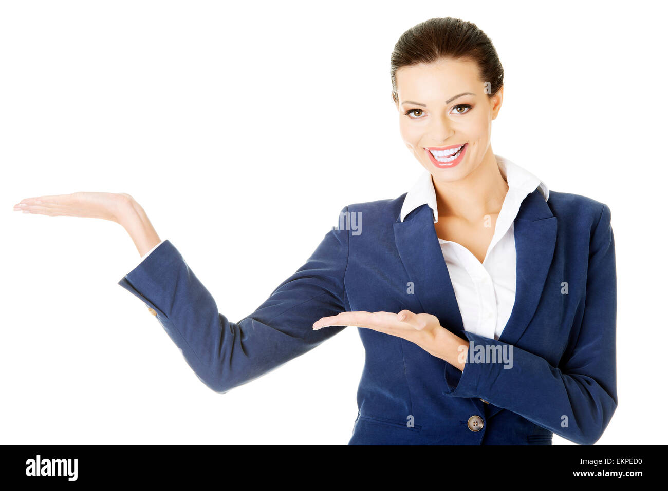 Happy young business woman showing copy space on her palm Stock Photo ...