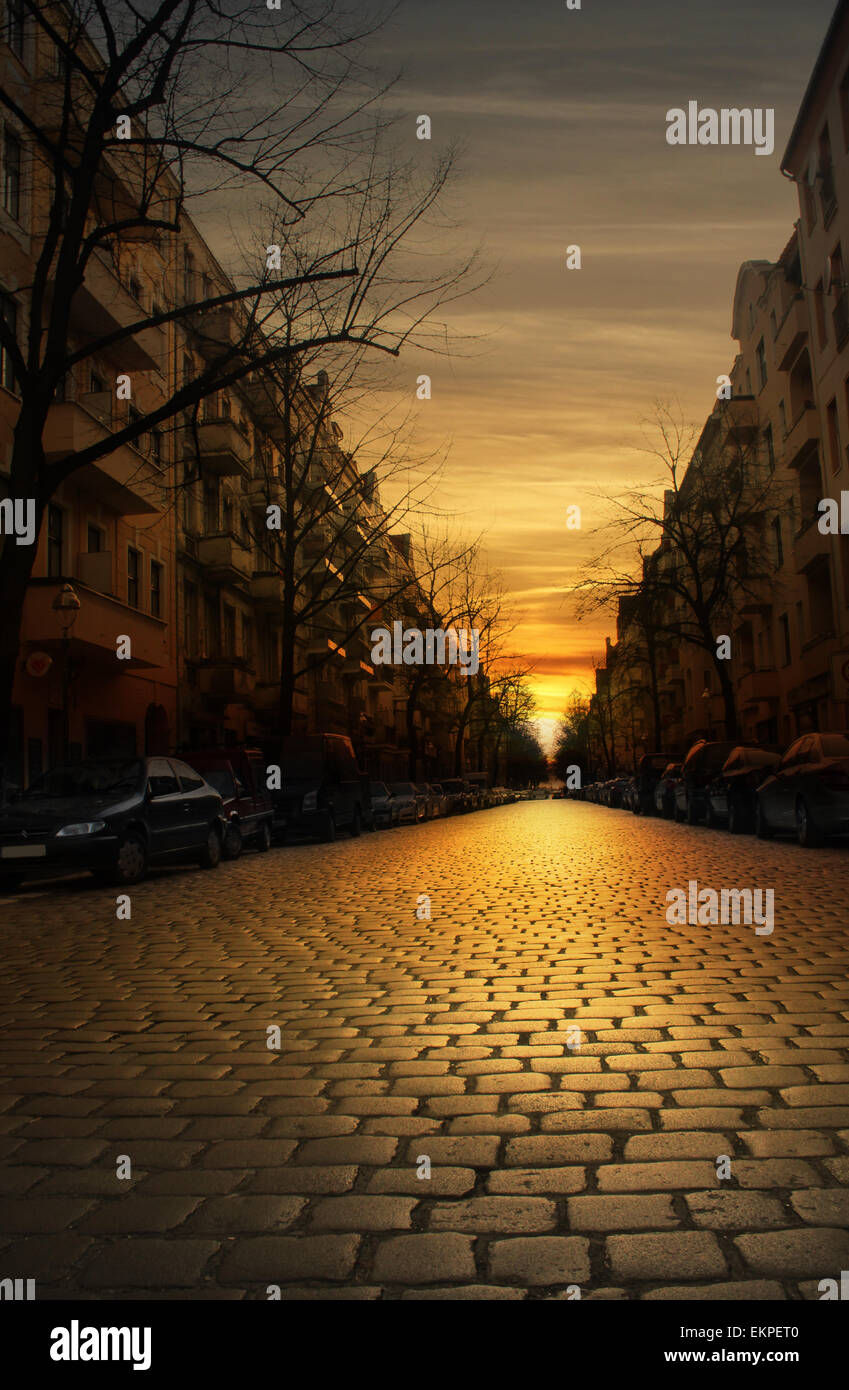 Cobblestone street at sunset Stock Photo - Alamy