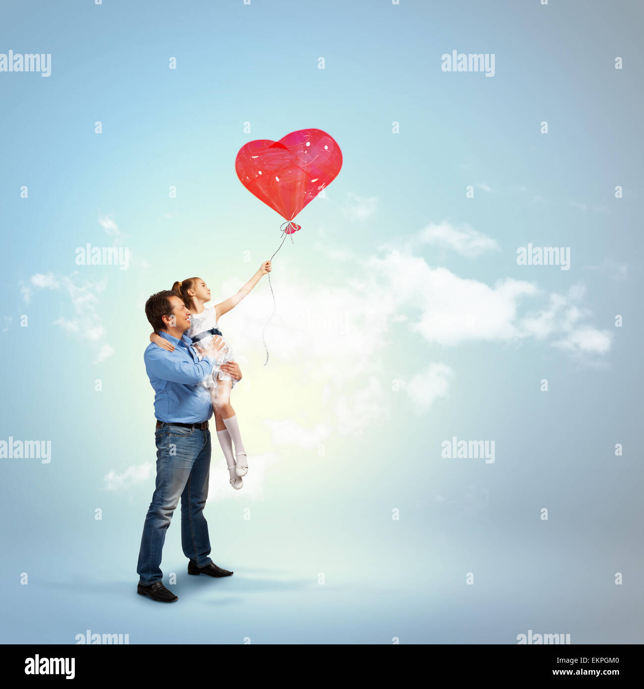 Father holding his daughter and a red heart Stock Photo - Alamy