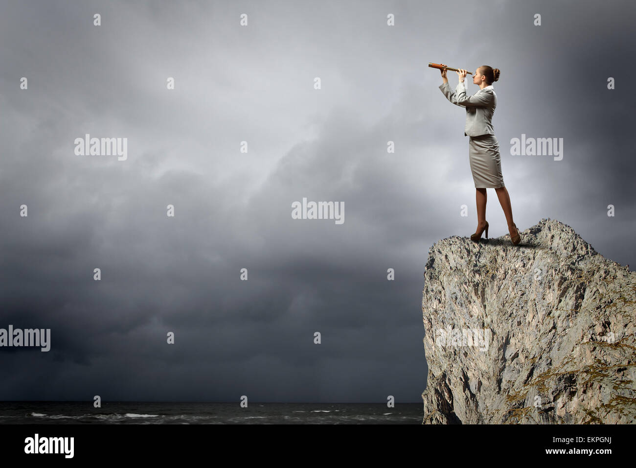 Business woman with telescope Stock Photo - Alamy