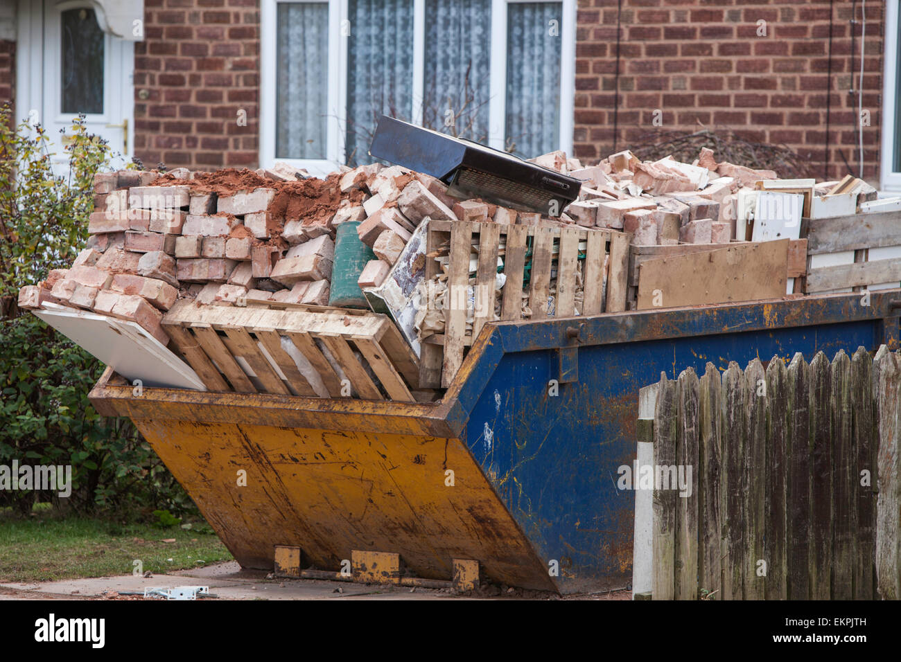 Overloaded skip, England ,UK Stock Photo