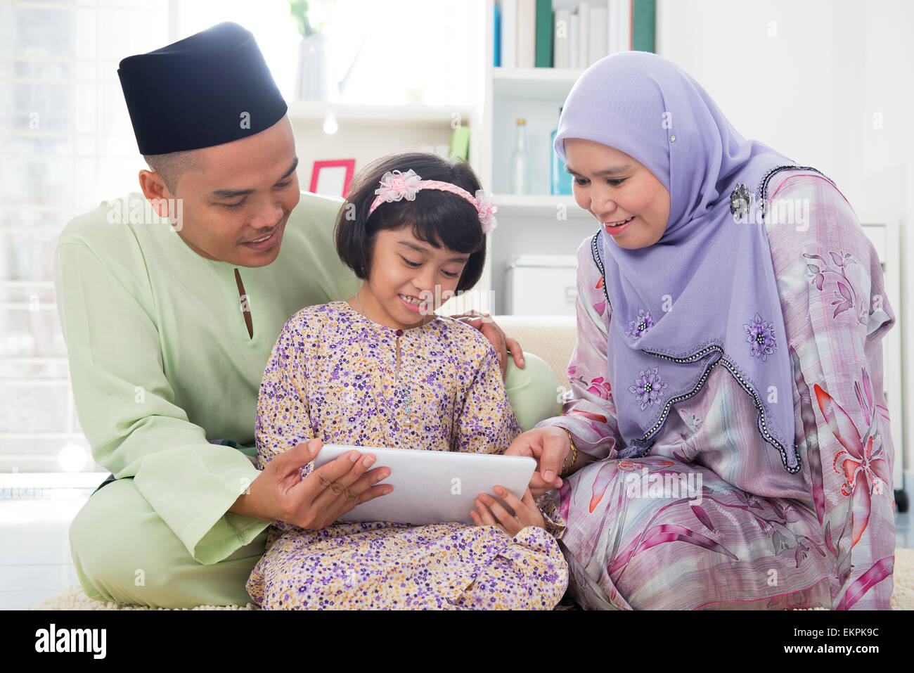 Happy modern family using hi-res stock photography and images - Alamy