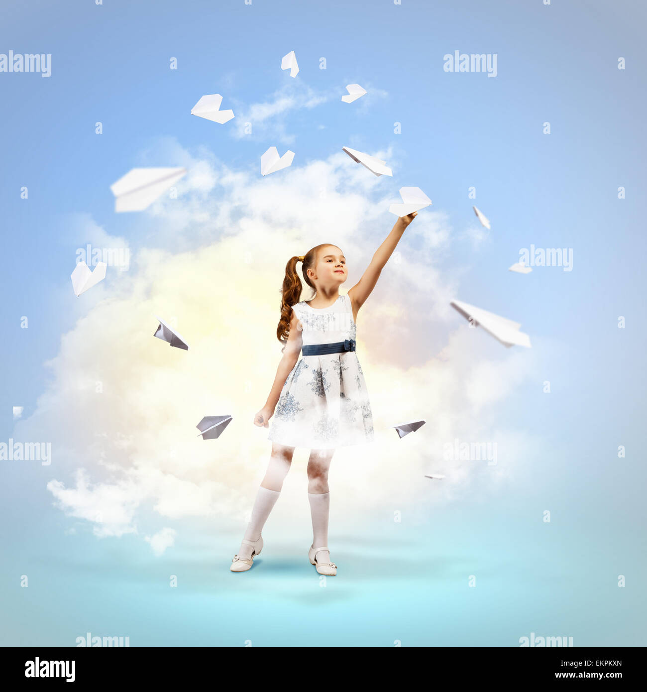 Little girl playing with paper airplane Stock Photo - Alamy