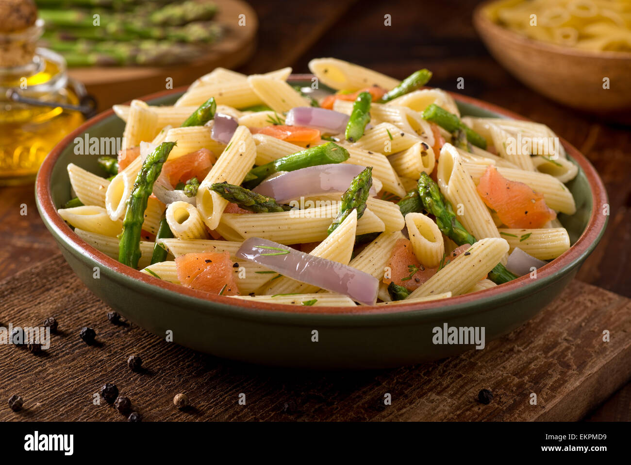 A delicious smoked salmon pasta with penne, asparagus, crushed black