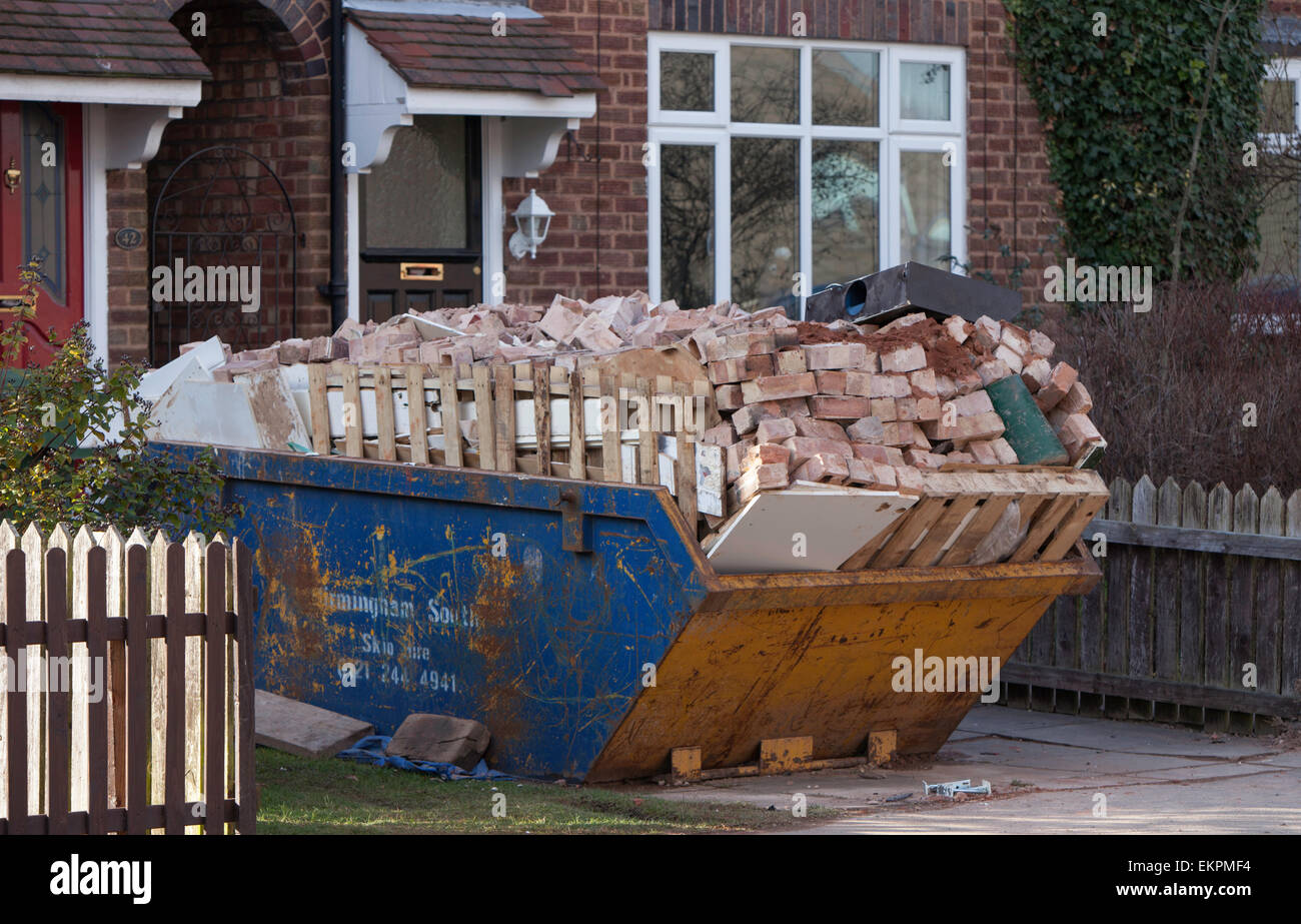 Overloaded skip, England ,UK Stock Photo Alamy