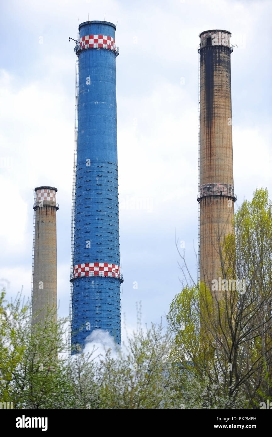 Industrial shot with three smoke towers of a thermal power plant Stock Photo