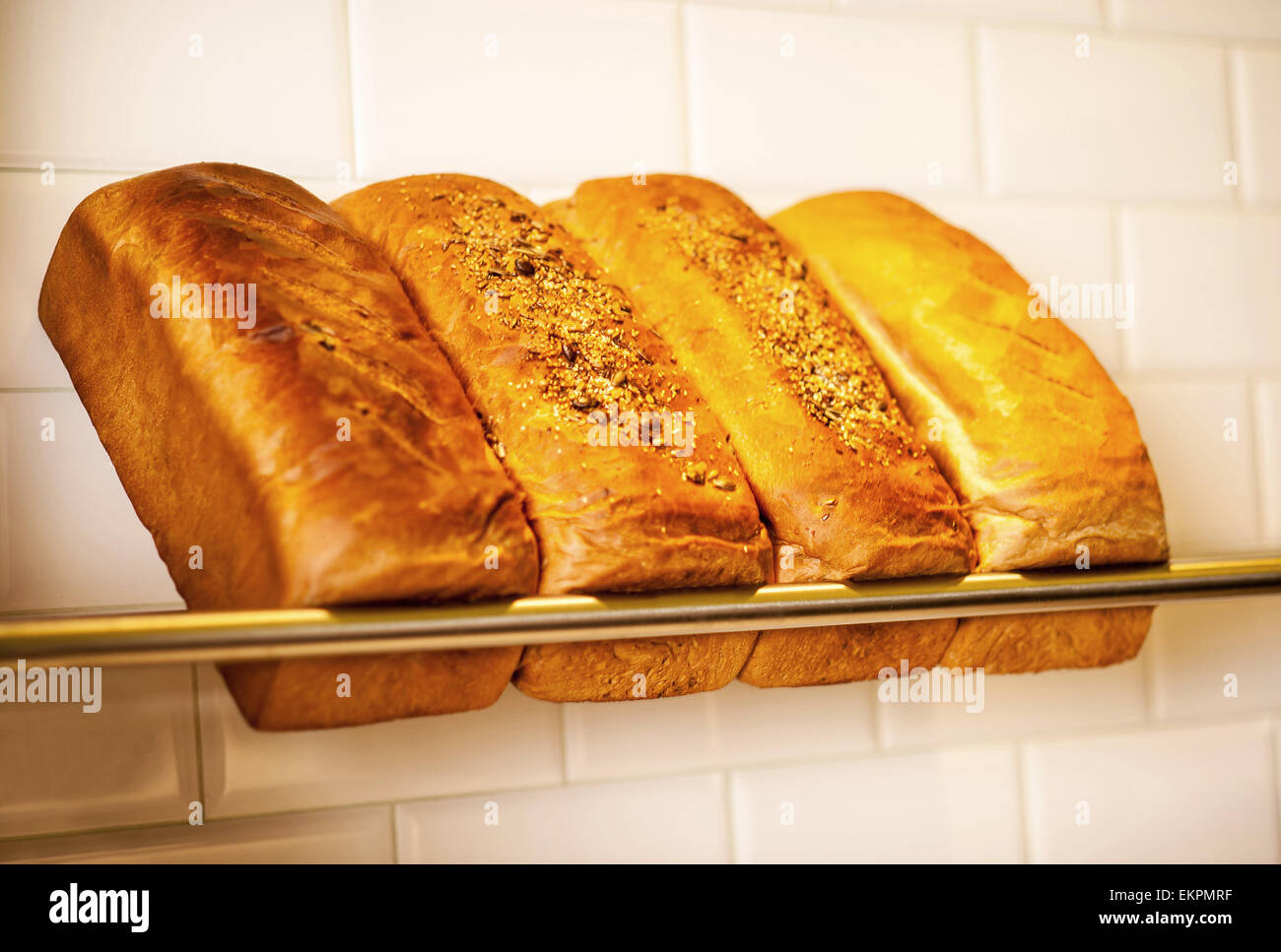 Freshly kneaded grain and white breads for sale Stock Photo