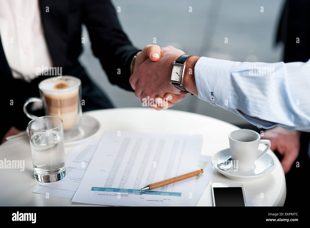 Business handshake over a coffee Stock Photo