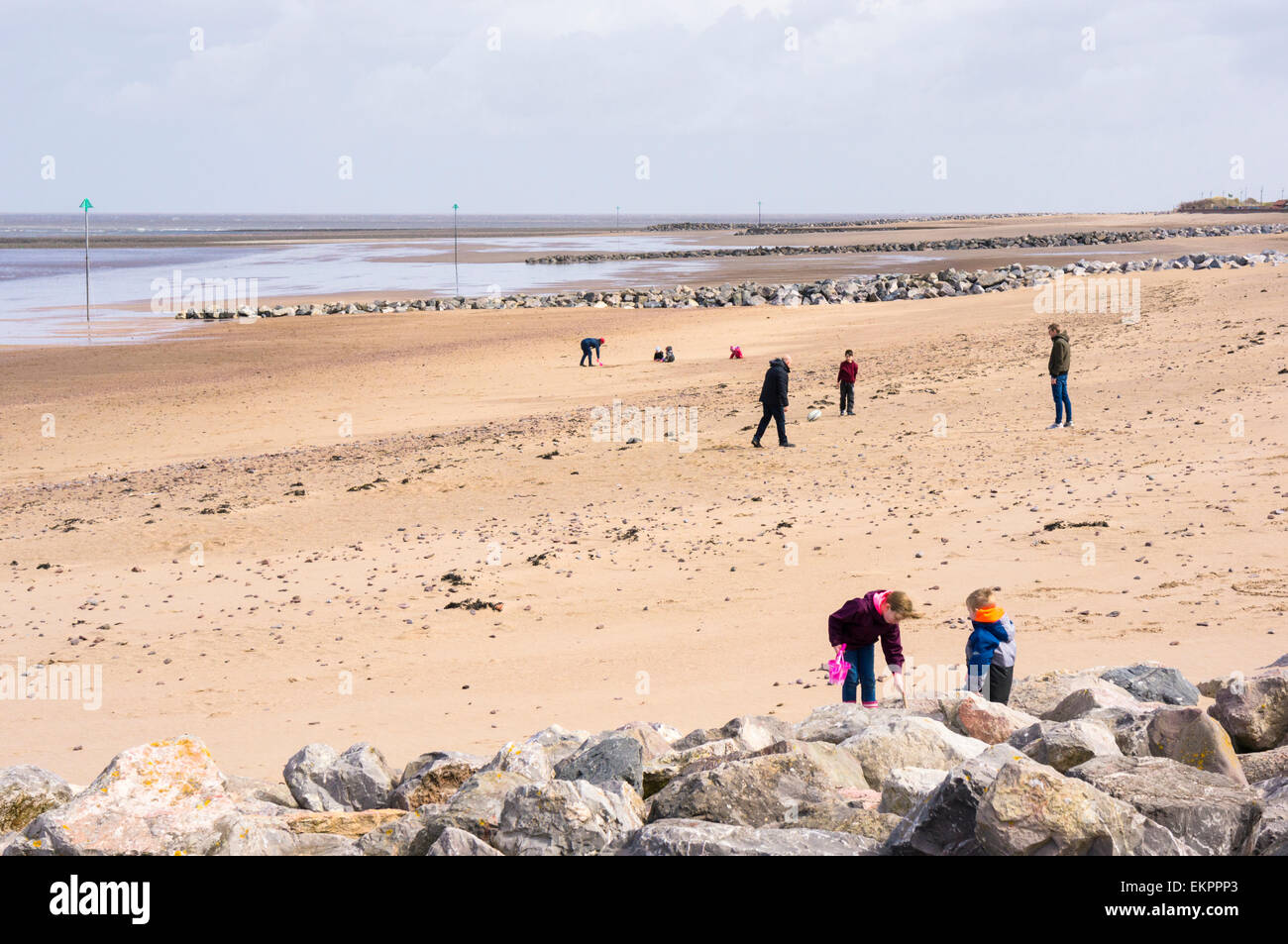 People on Minehead beach, Somerset coast in spring Stock Photo