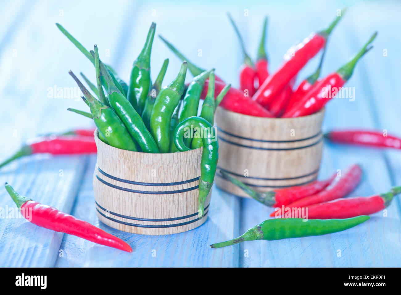 green and red chilli peppers on a table Stock Photo - Alamy
