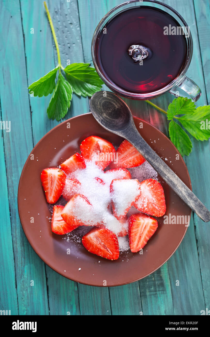 fresh strawberry with sugar on the plate Stock Photo - Alamy