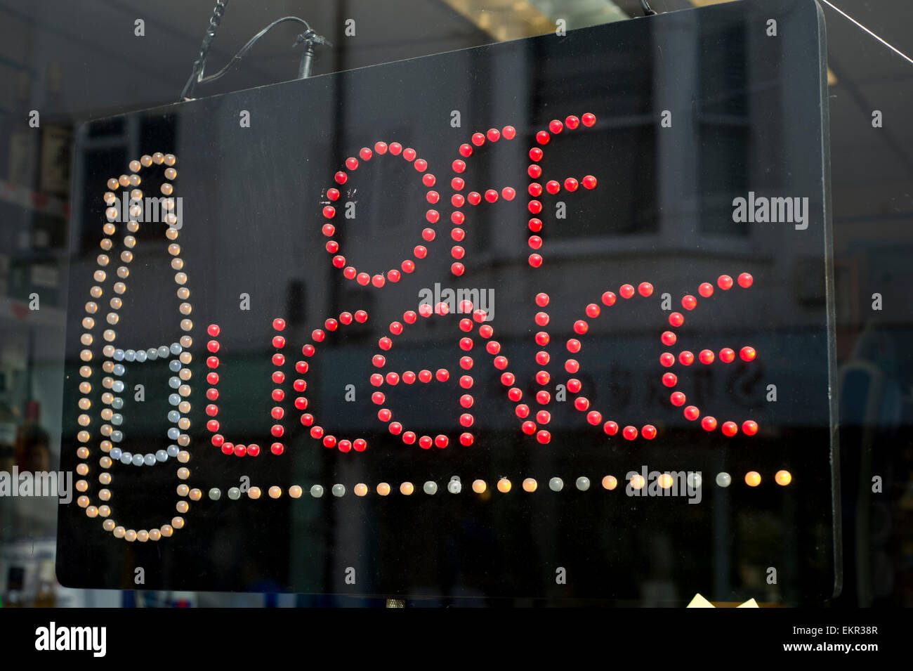 illuminated off licence sign, Brighton Stock Photo Alamy
