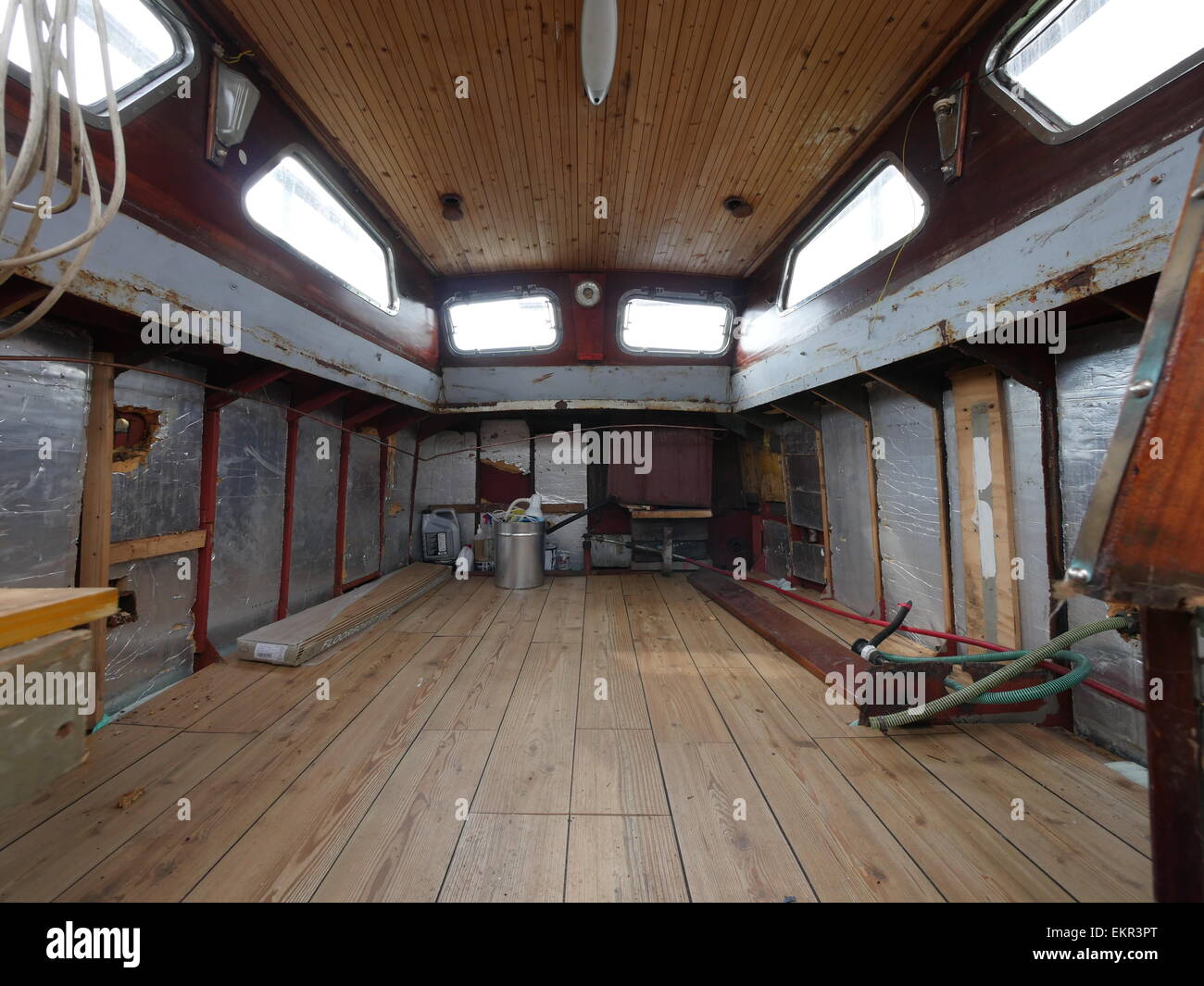 interior view of an old steel hulled boat in process of being stripped down and repaired and refurbished as a project Stock Photo