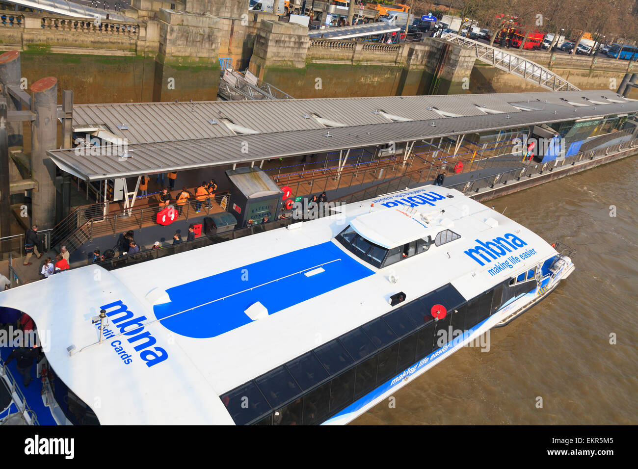 Looking down on am MBNA river cruiser moored on the embankment pier of the Thames in london Stock Photo