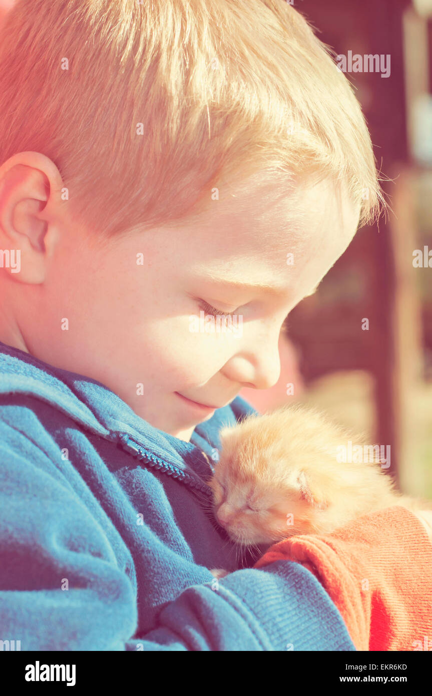 boy warm kitten love Stock Photo