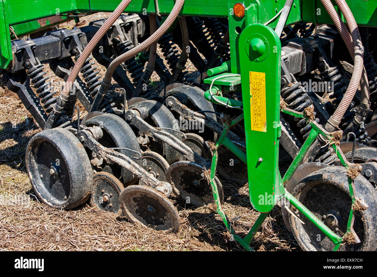 Close up of John Deere 750A notill seed drill working on farmland