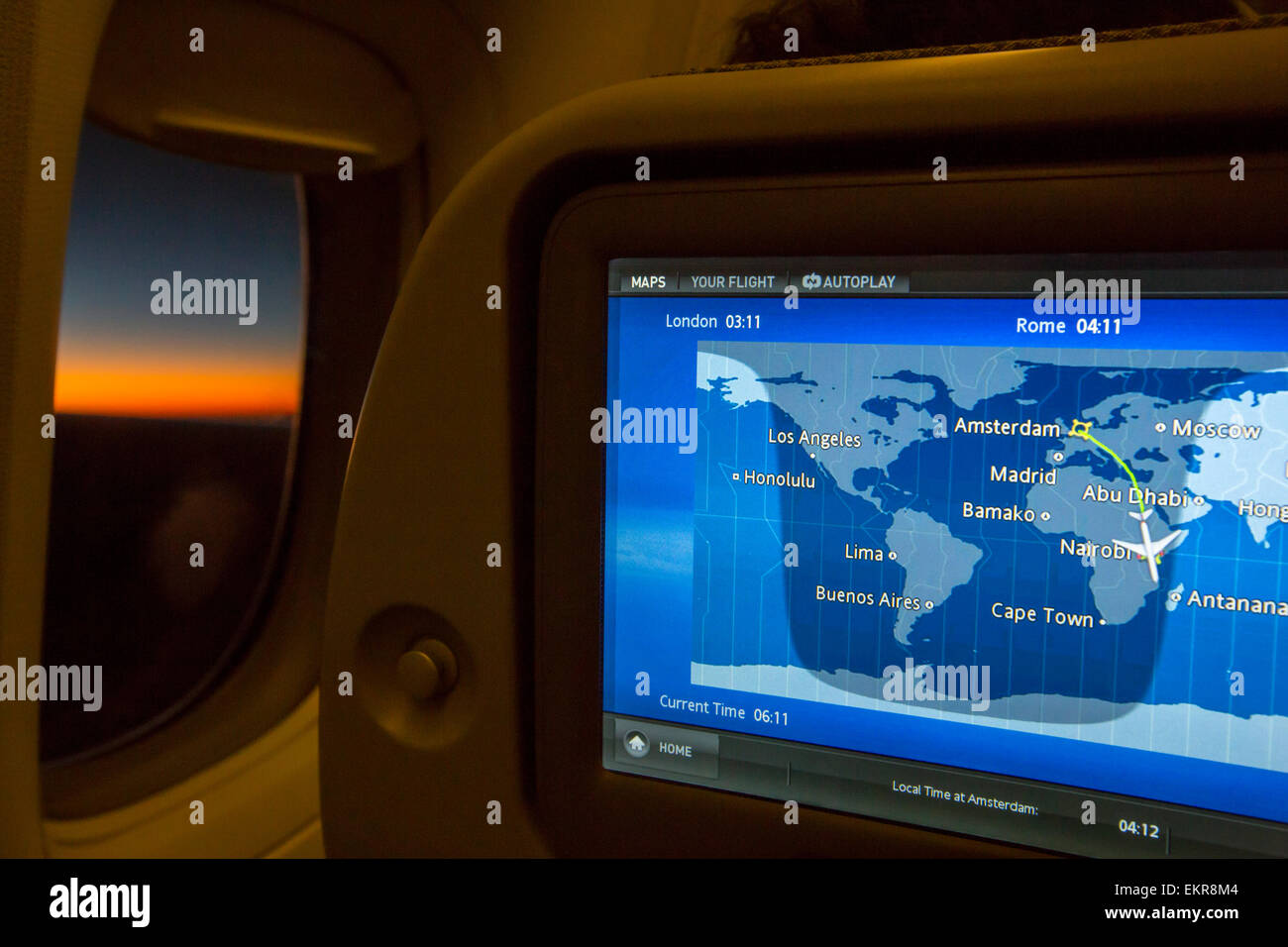 An airplane seat monitor showing a plane heading to Nairobi in Kenya, with the area of light and dark being shown on the globe, Stock Photo