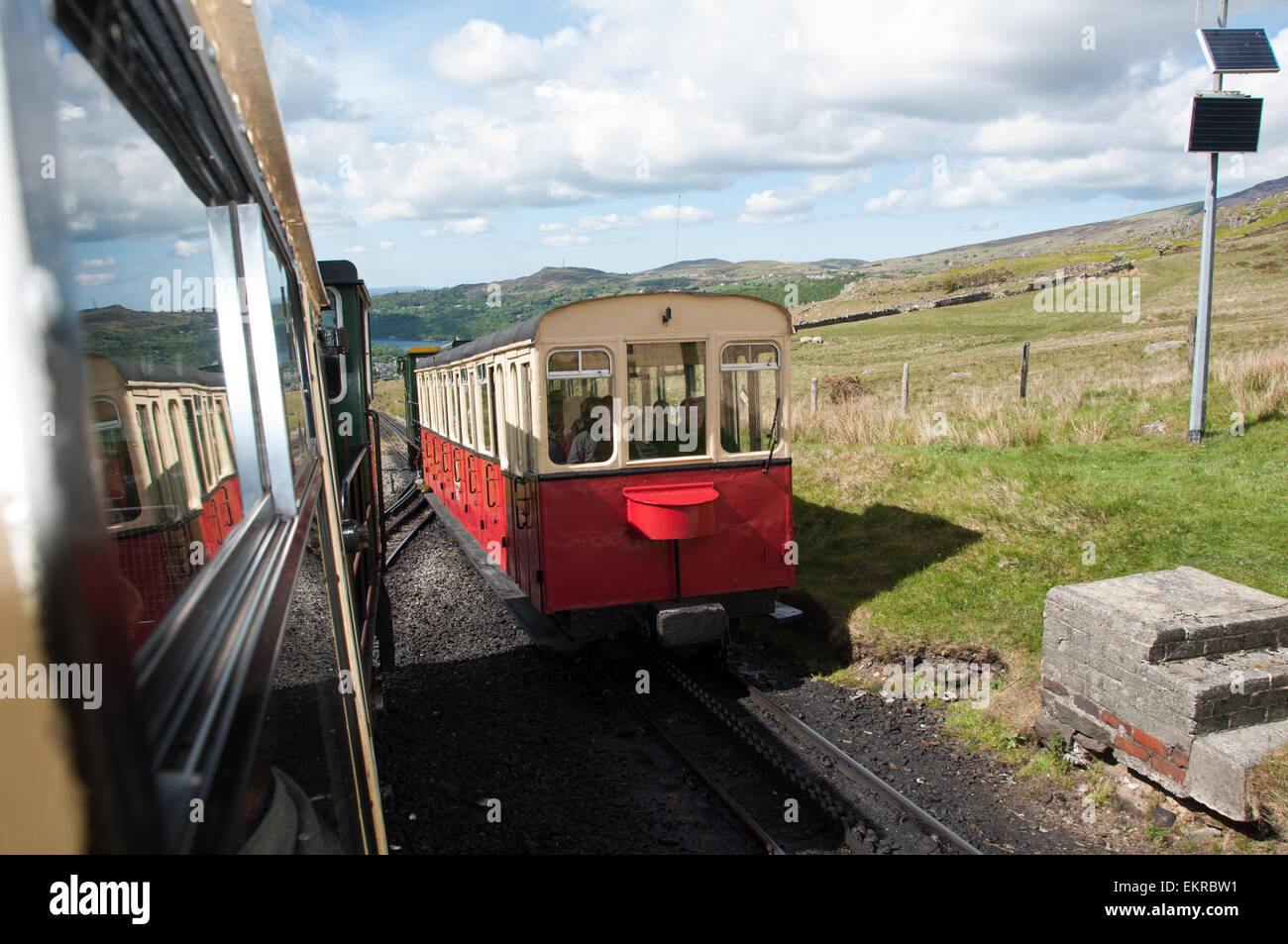 View of the Snowdon Mountain railway locomotion going up the mountain Stock Photo