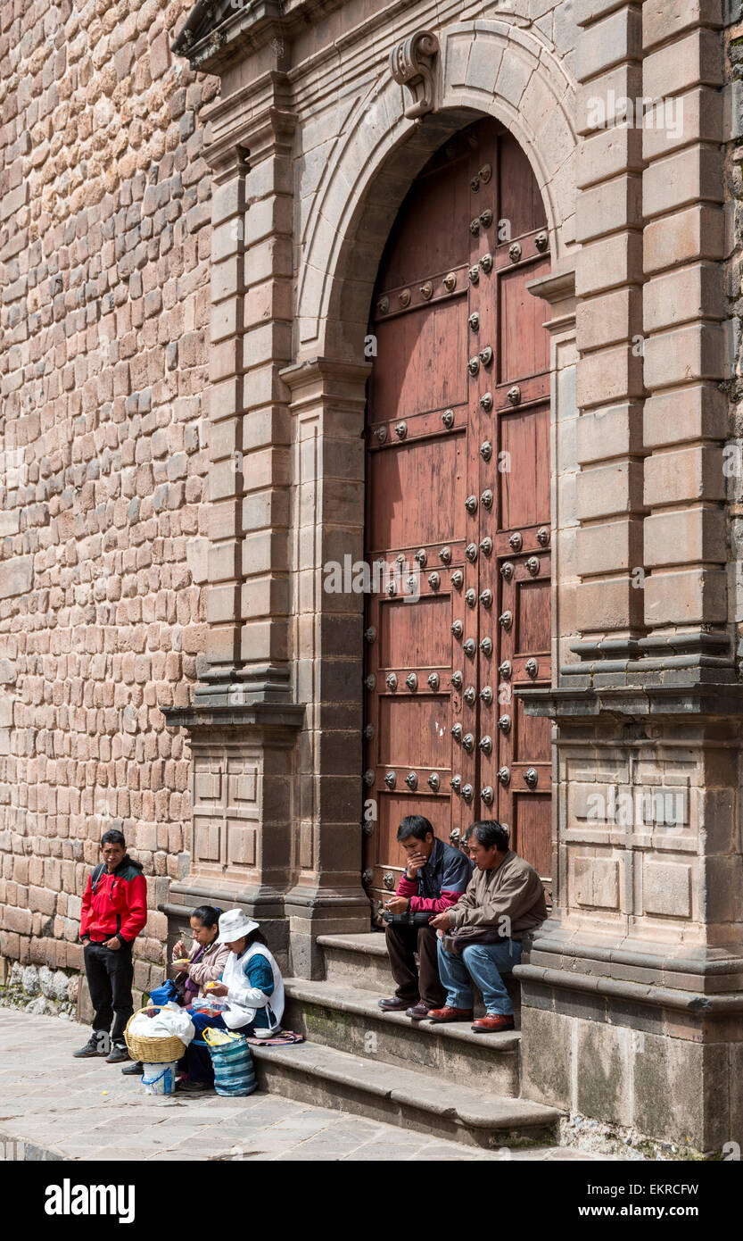 Peru, Cusco.  Peruvians in front of Side Entrance to Church. Stock Photo