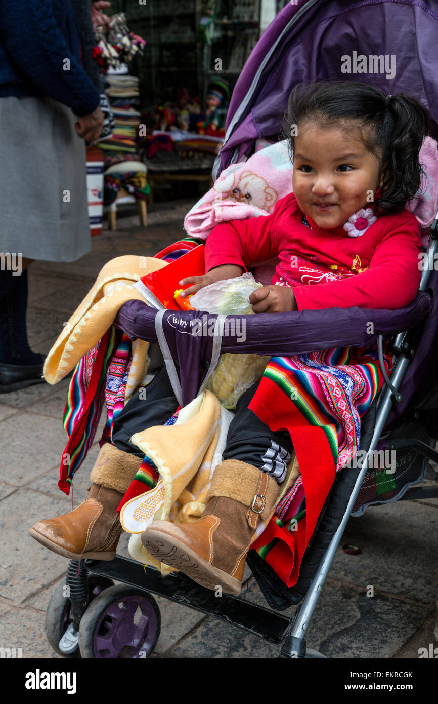 Peru, Cusco.  Little Peruvian Girl in her Stroller. Stock Photo