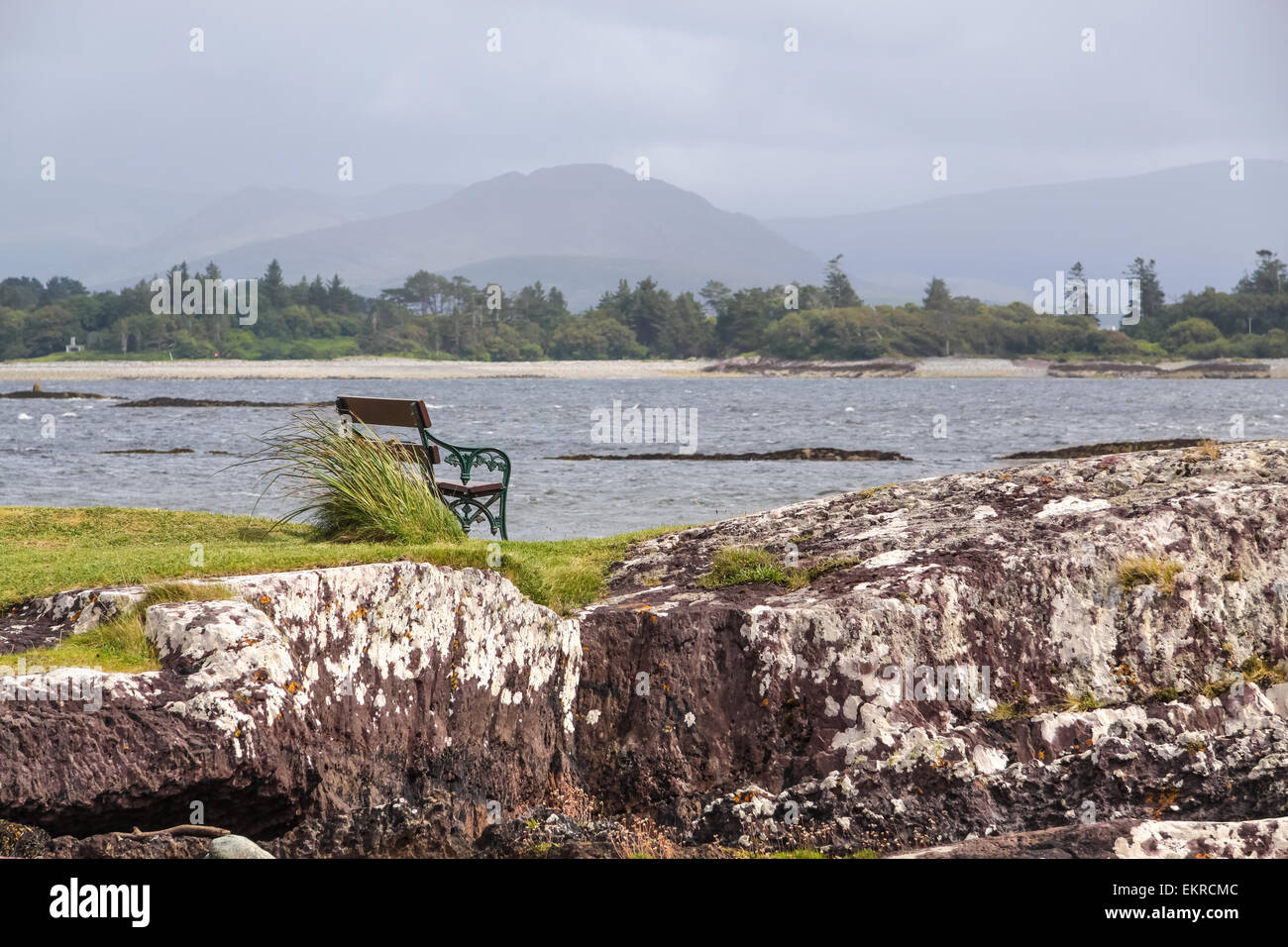 Bench by the sea in rough weather at Parknasilla, County Kerry, Ireland Stock Photo