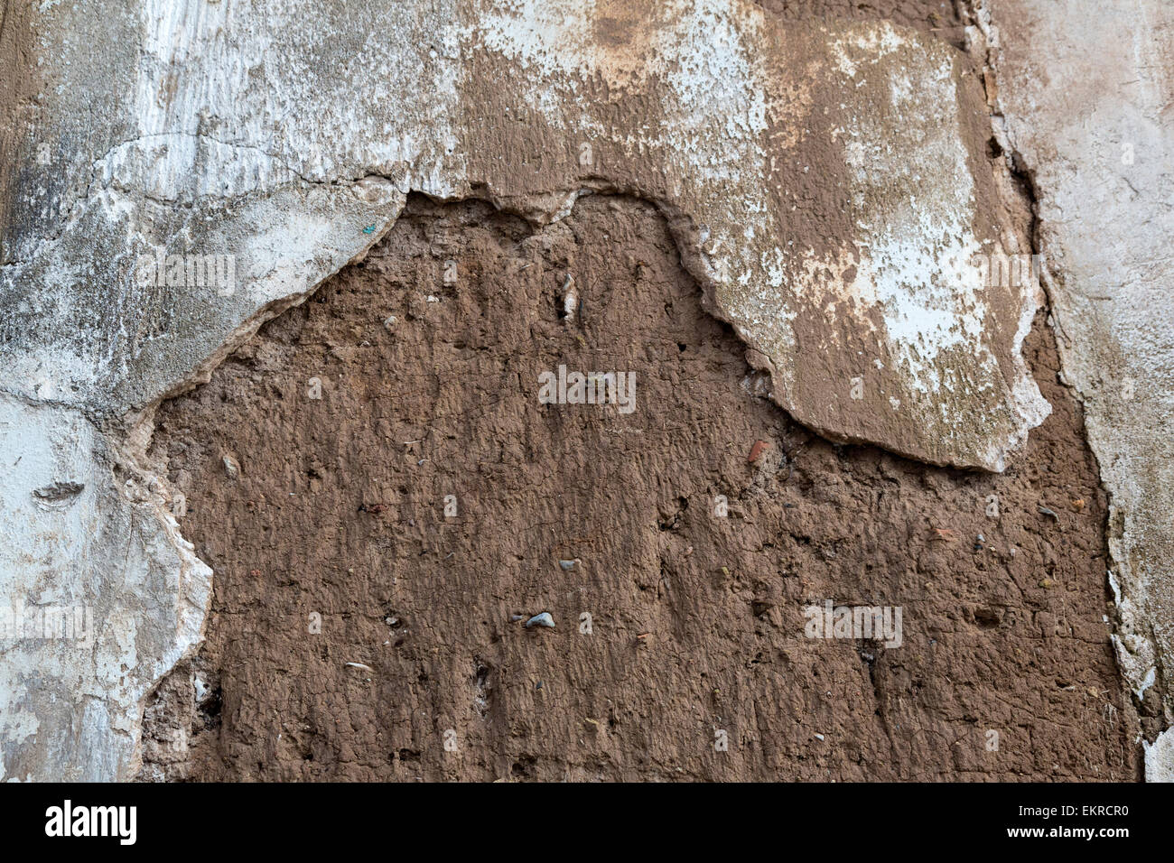 Peru, Cusco.  Falling Plaster Reveals Mud-brick Construction of Houses in Old Residential Areas above the Plaza de Armas. Stock Photo