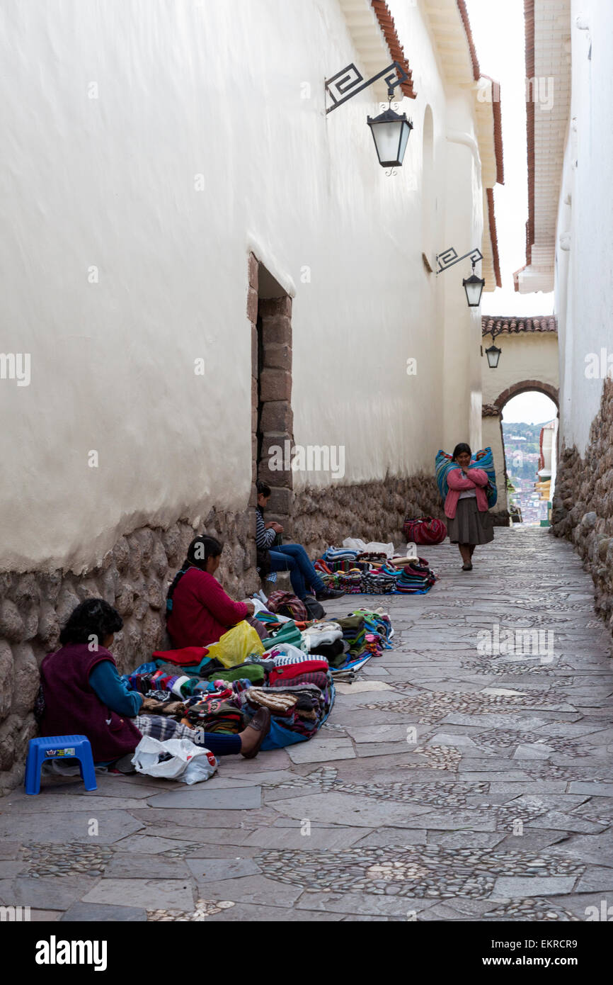 Peru, Cusco. Quechua Women Selling Knitted Items in a Street above the Plaza de Armas. Stock Photo