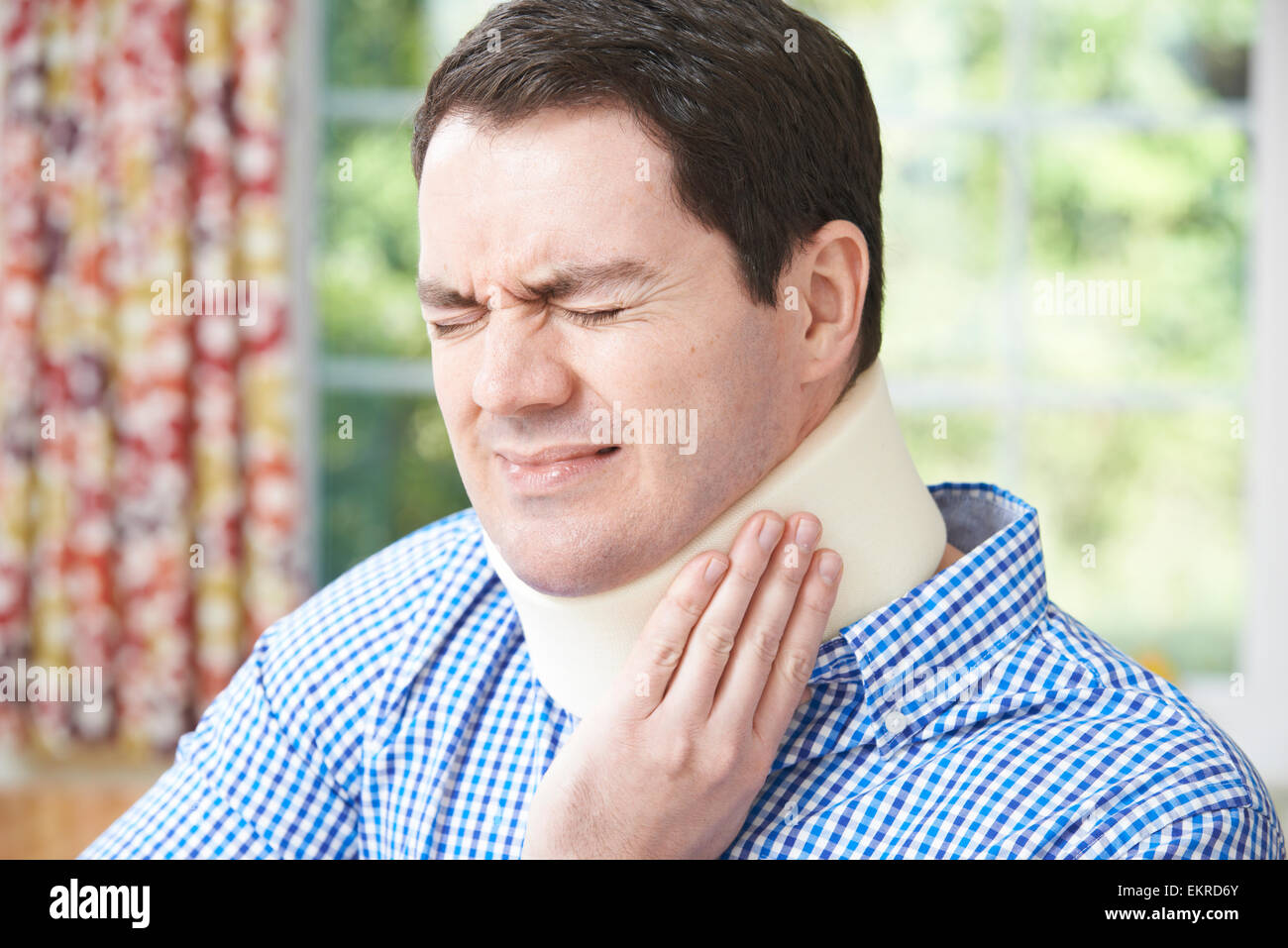 Man Wearing Surgical Collar In Pain Stock Photo Alamy