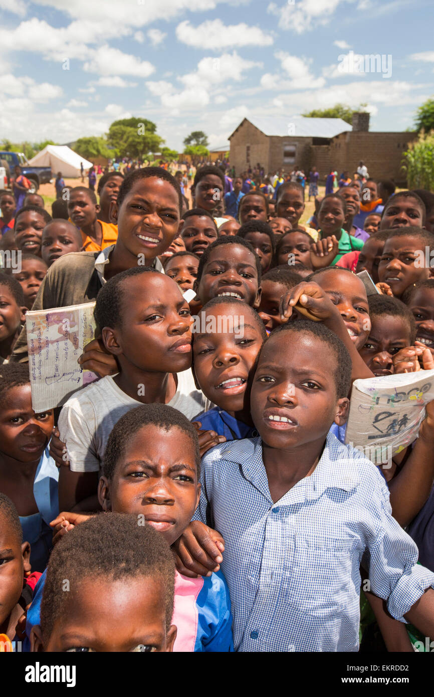 In mid January 2015, a three day period of excessive rain brought unprecedented floods to the small poor African country of Malawi. It displaced nearly quarter of a million people, devastated 64,000 hectares of land, and killed several hundred people. This shot shows displaced children in Baani refugee camp near Phalombe. Stock Photo