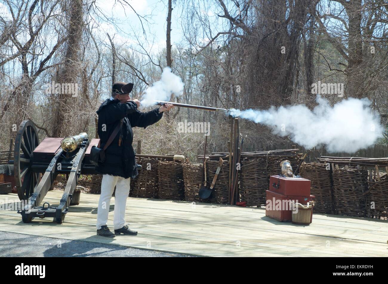 Reenctor firing a musket Stock Photo