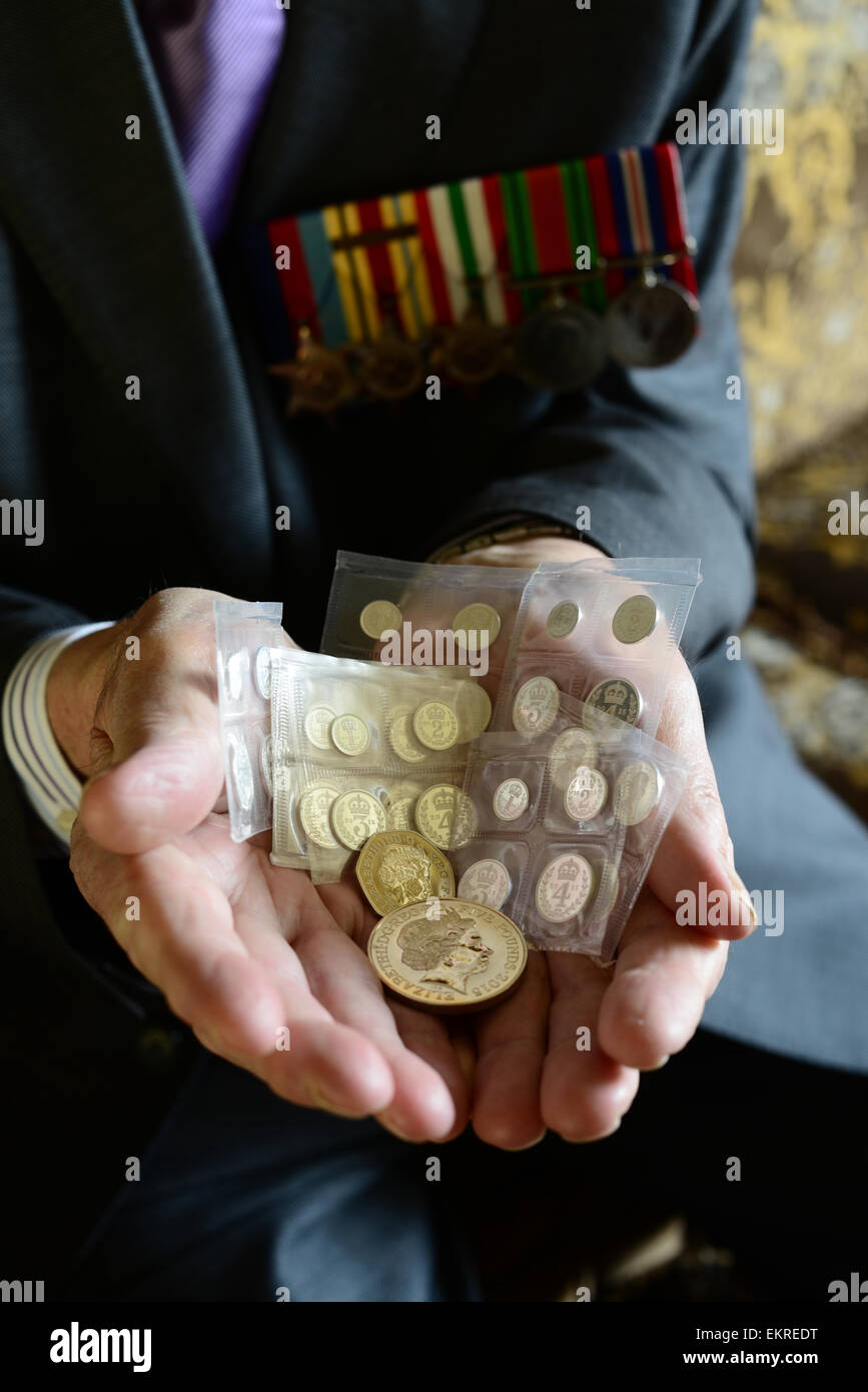 A World War Two veteran with Maundy money presented to him by the Queen. Picture: Scott Bairstow/Alamy Stock Photo