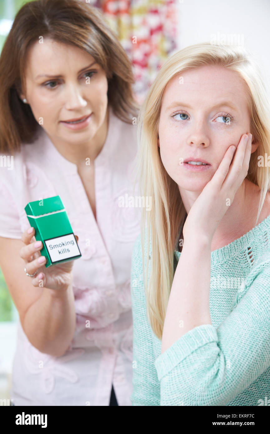 Mother Confronting Daughter Over Dangers Of Smoking Stock Photo