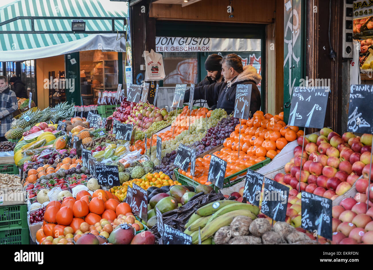 Vienna Naschmarkt food stand fruit with two sellors Stock Photo