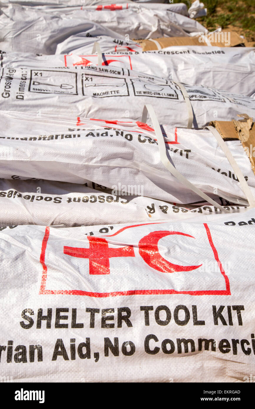 In mid January 2015, a three day period of excessive rain brought unprecedented floods to the small poor African country of Malawi. It displaced nearly quarter of a million people, devastated 64,000 hectares of land, and killed several hundred people. This shot shows Red Cross shelter tool kits waiting to be airlifted into flood affected areas in Bangula. Stock Photo