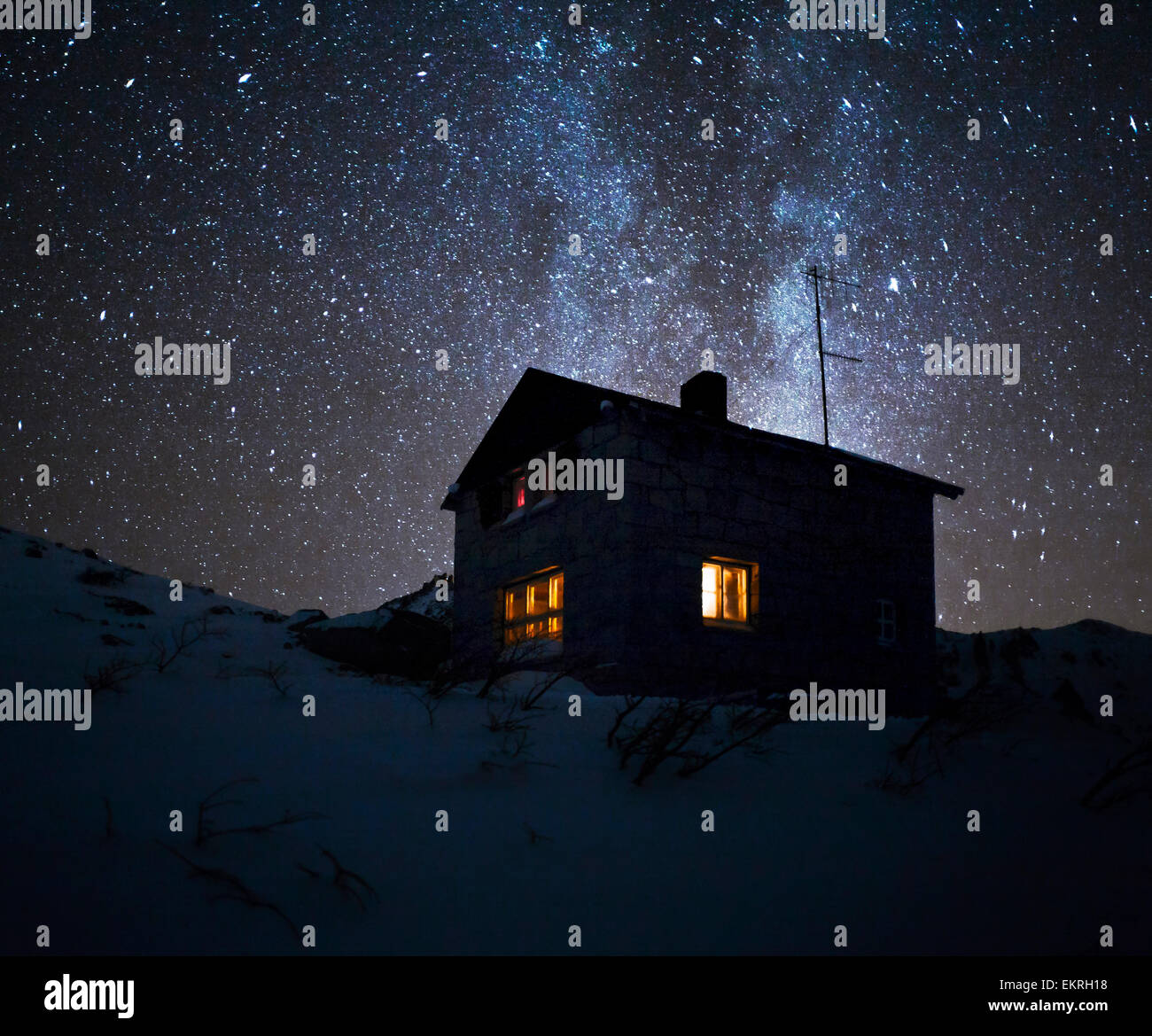 Mountain lodge at night with starry sky and milky way. Patagonia Argentina Stock Photo