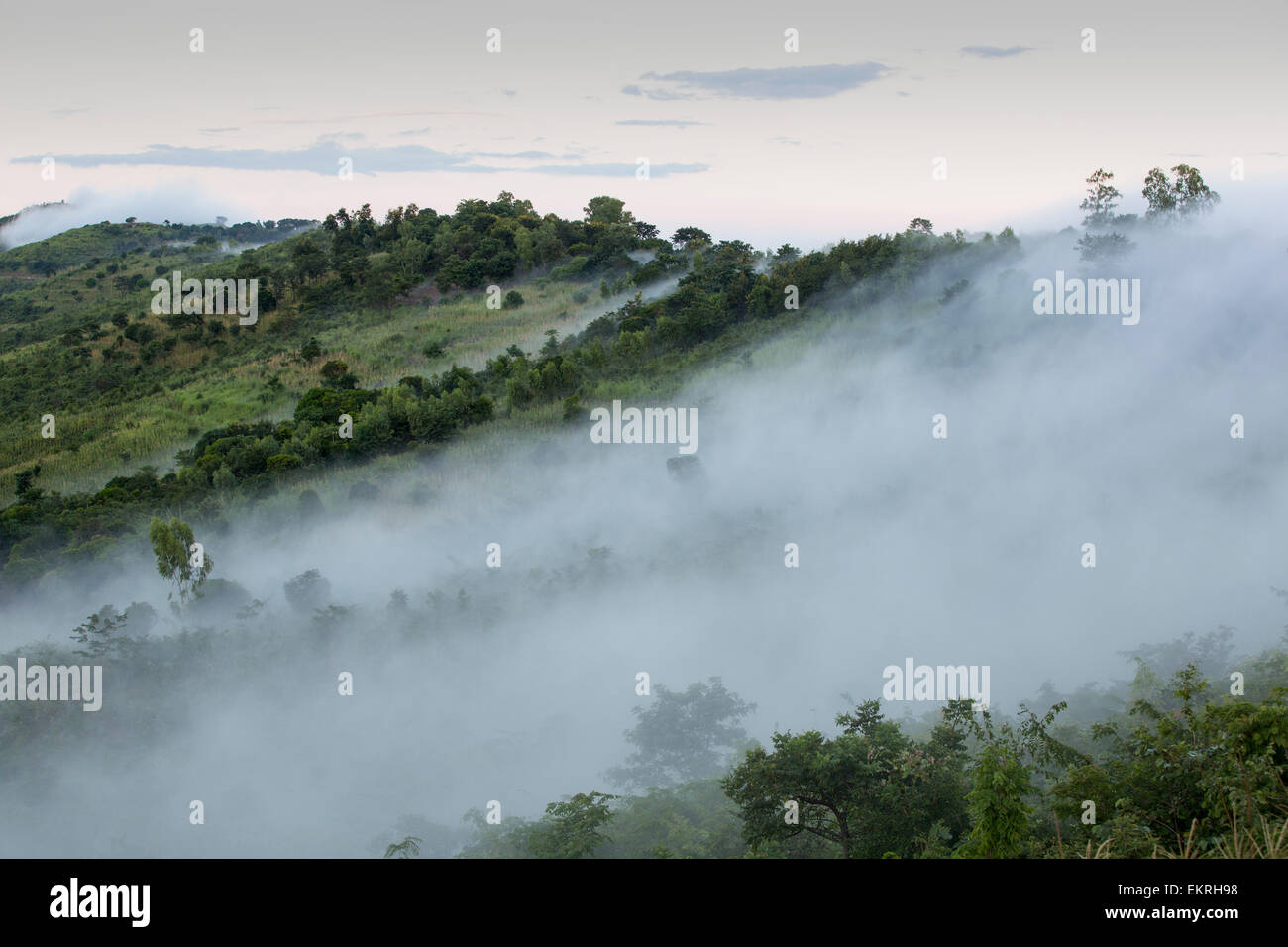Morning Mist spilling down from the plateau into the lower shire river valley in Malawi, Africa. Stock Photo