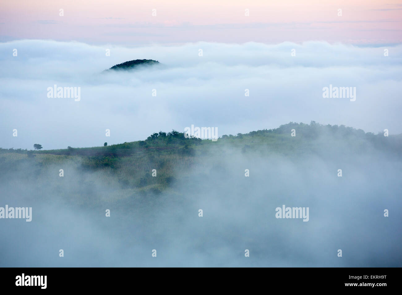 Morning Mist spilling down from the plateau into the lower shire river valley in Malawi, Africa. Stock Photo
