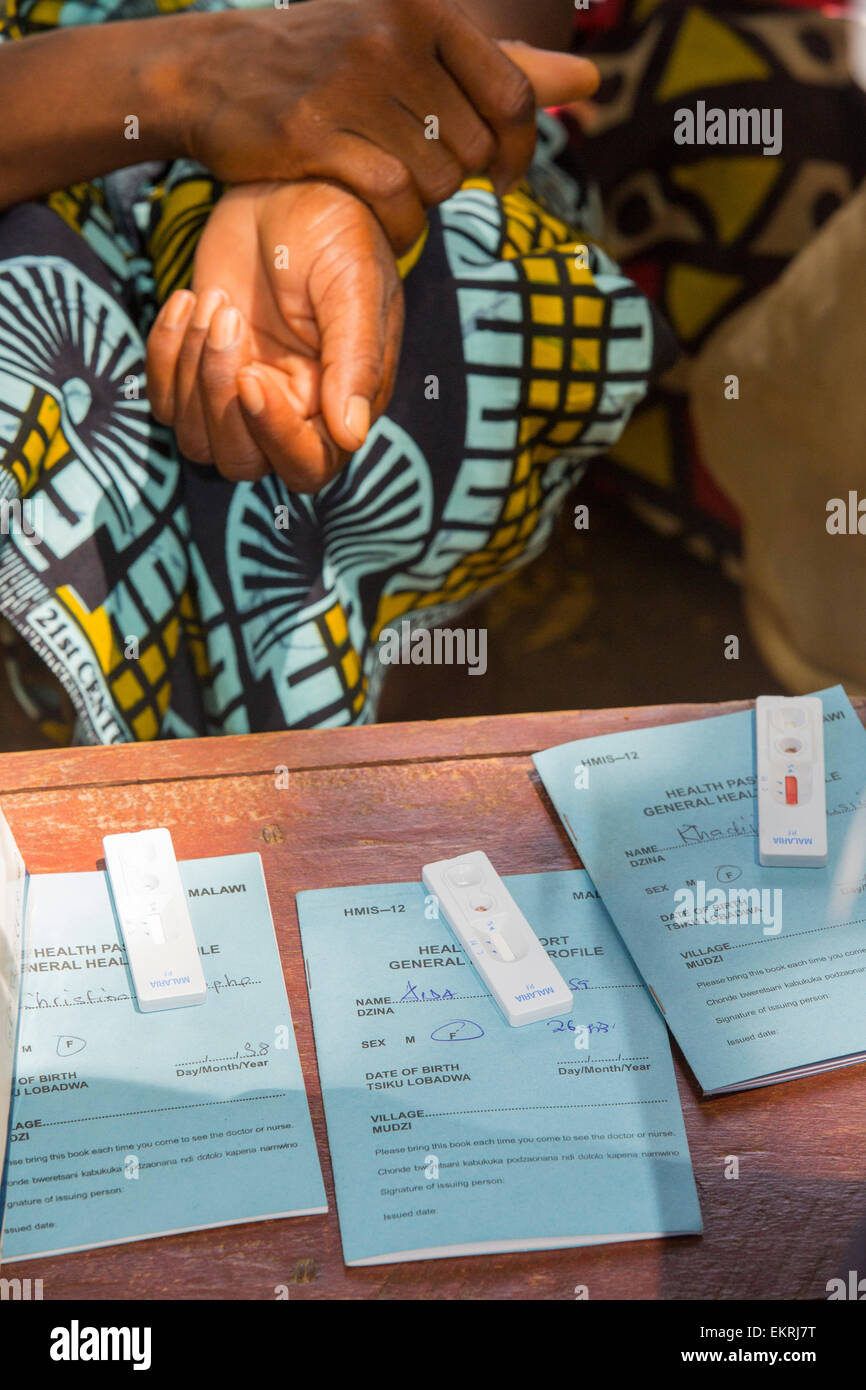 In mid January 2015, a three day period of excessive rain brought unprecedented floods to the small poor African country of Malawi. It displaced nearly quarter of a million people, devastated 64,000 hectares of land, and killed several hundred people. This shot shows A Medicin Sans Frontieres clinic in Makhanga blood testing local people for malaria, many proving positive for the disease as a result of the drying up flood waters providing ideal breeding grounds for mosquitoes. Stock Photo