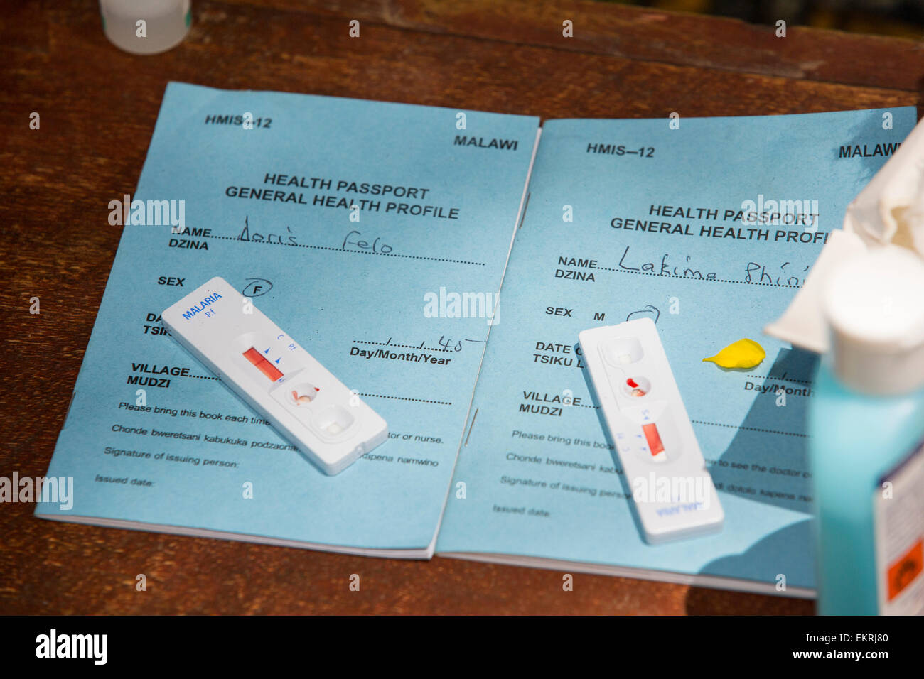 In mid January 2015, a three day period of excessive rain brought unprecedented floods to the small poor African country of Malawi. It displaced nearly quarter of a million people, devastated 64,000 hectares of land, and killed several hundred people. This shot shows A Medicin Sans Frontieres clinic in Makhanga blood testing local people for malaria, many proving positive for the disease as a result of the drying up flood waters providing ideal breeding grounds for mosquitoes. Stock Photo