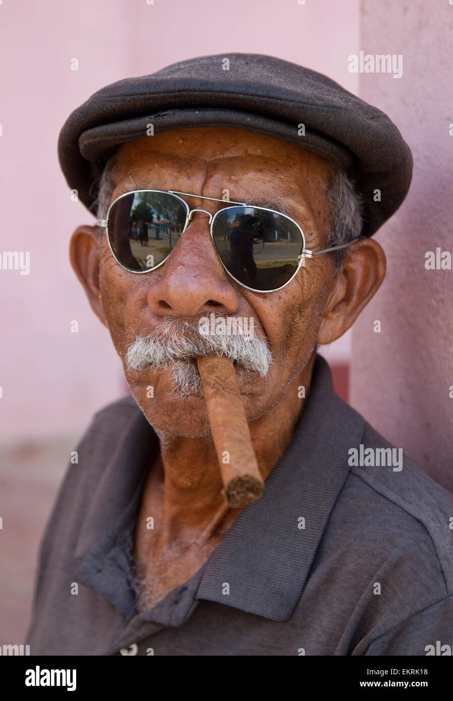 A Cuban man wearing sunglasses smoking a cigar in Vinales Stock Photo