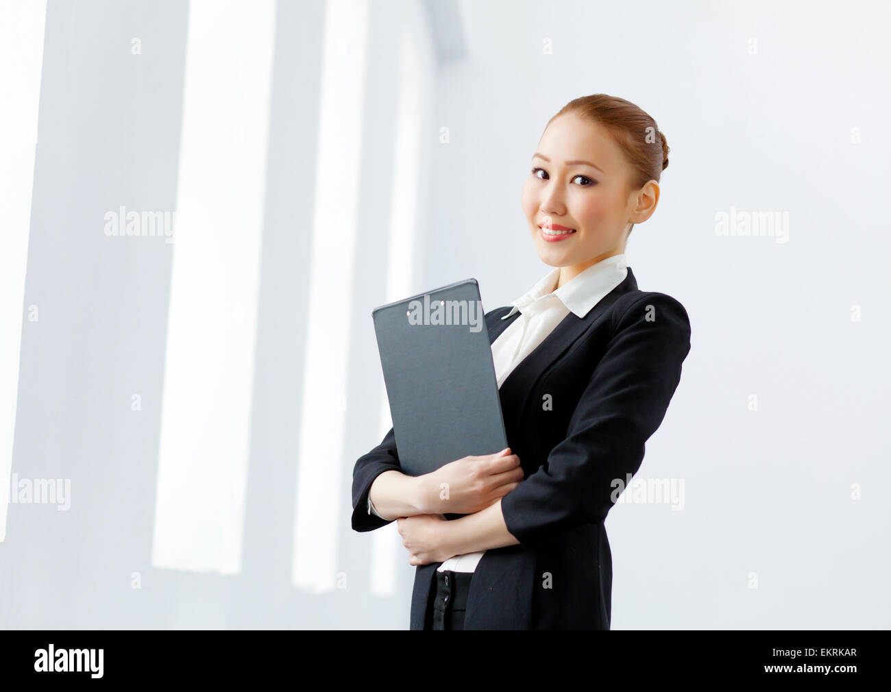 Attractive asian businesswoman in formal suit Stock Photo - Alamy