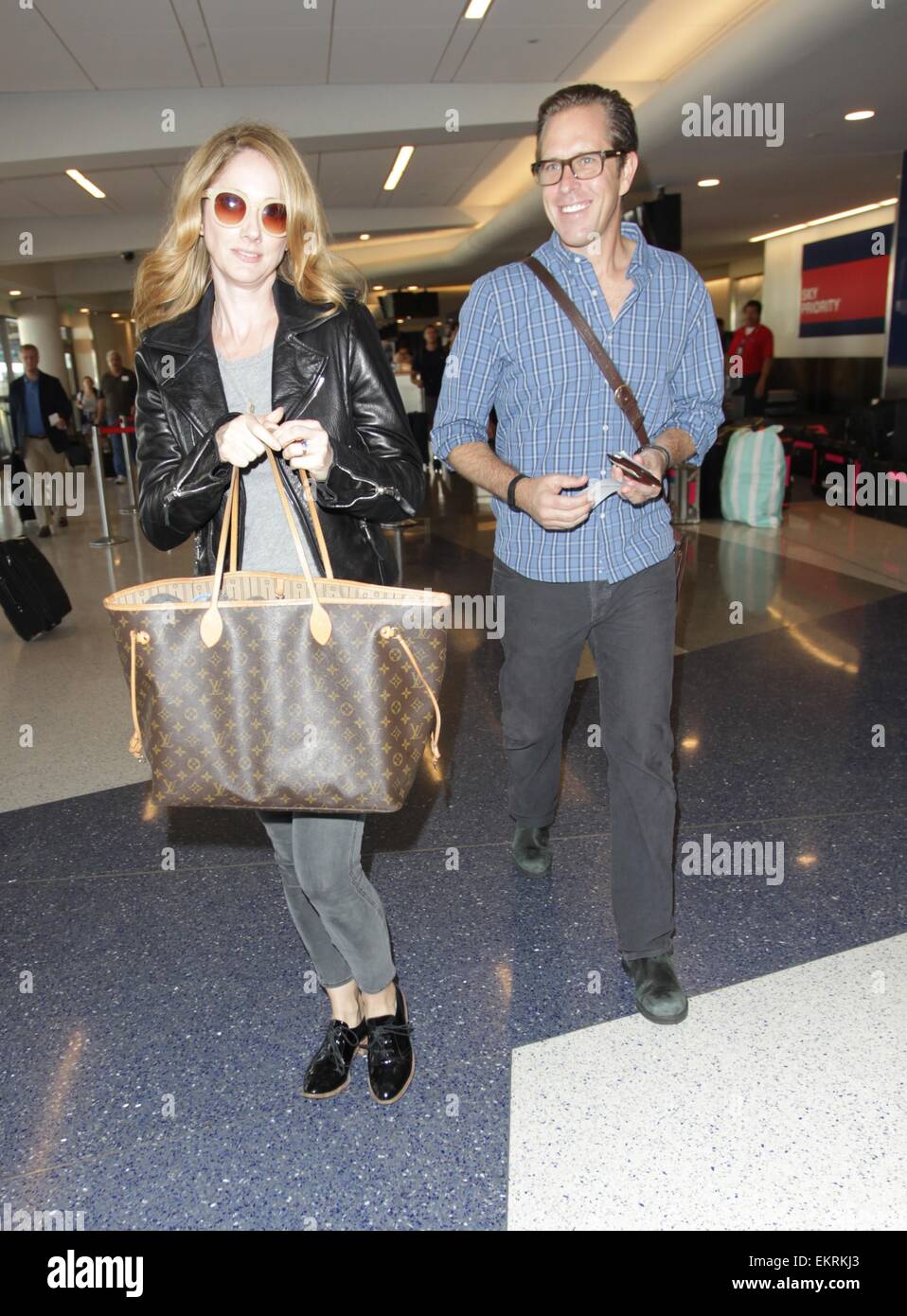 Judy Greer with her husband depart from Los Angeles International