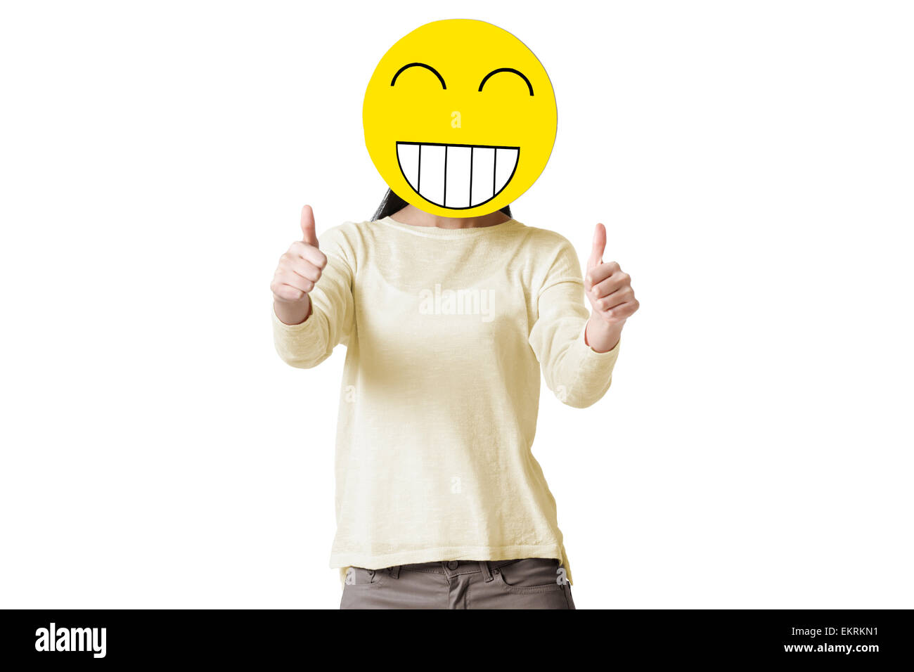 Young Woman Giving Thumbs Up With Happy Emoticon Face In Front Of Her Face Stock Photo Alamy