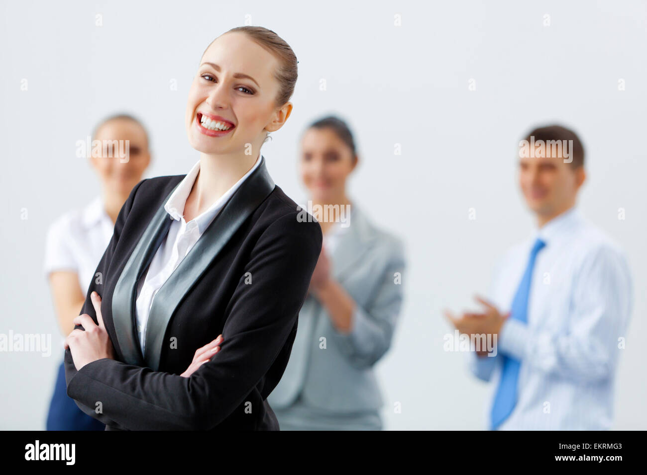 Four businesswomen standing in row Stock Photo - Alamy
