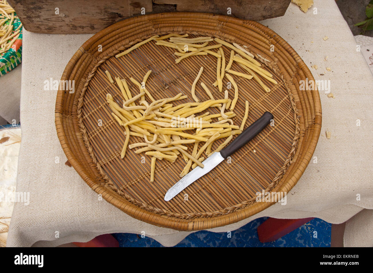 Lula,Sardinia,Italy, 10/2012. Home made fresh Macarrones pasta, ready to cook, in a traditional Sardinian basket Stock Photo