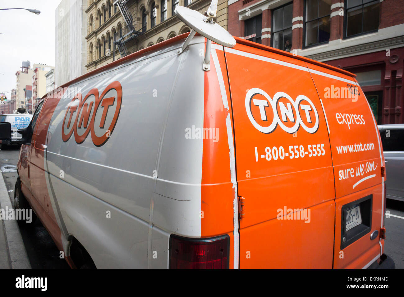 A TNT Express delivery van parked in Soho in New York on Tuesday, April 7, 2015. FedEx announced it will buy the Dutch delivery service TNT Express for 4.4 billion euros. FedEx gains TNT's extensive ground service complemented by FedEx' fleet of planes. (© Richard B. Levine) Stock Photo