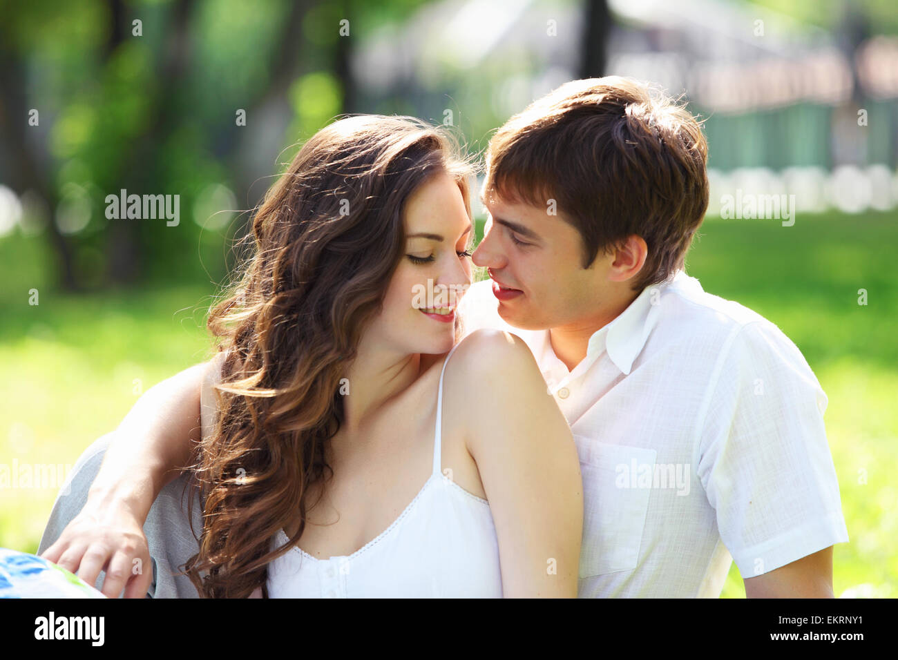 Young love Couple smiling under blue sky Stock Photo - Alamy