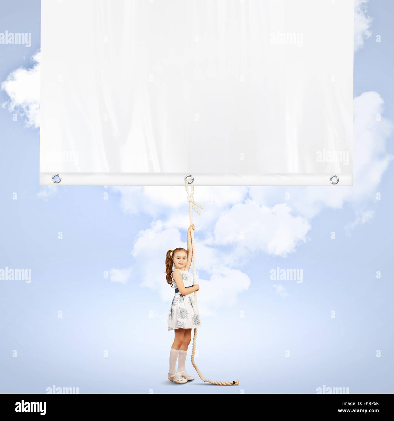 Little girl pulling banner Stock Photo